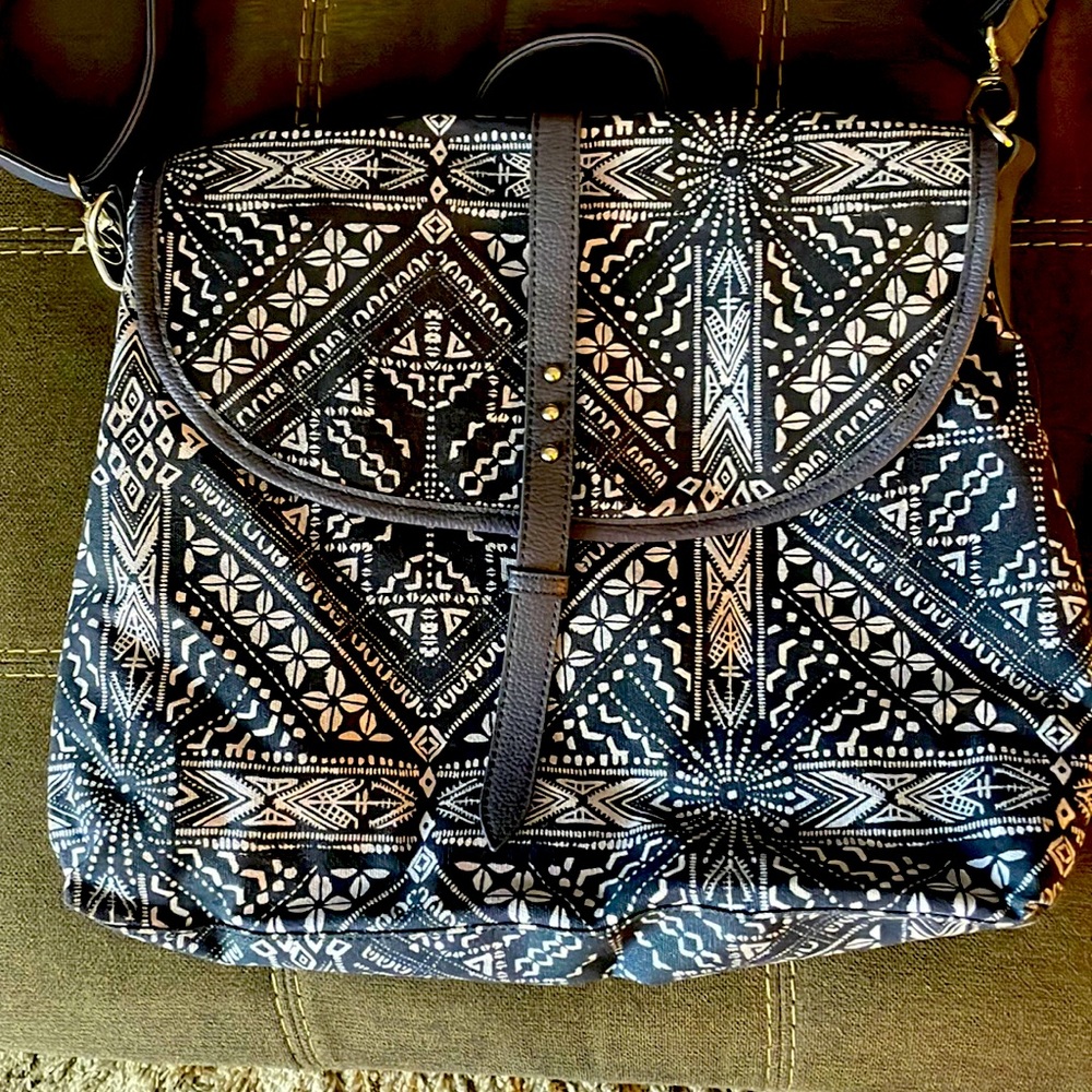 Crown Vintage. Dual use, can be a back pack or use as a satchel.
